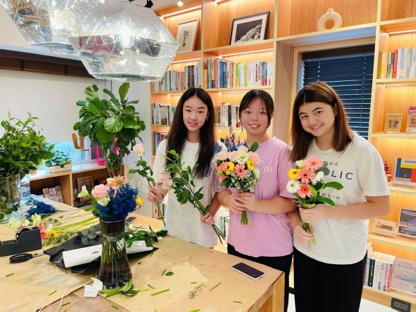 Members of Flourishing Love arrange bouquets together. [PHOTO COURTESY OF FLOURISHING LOVE]
