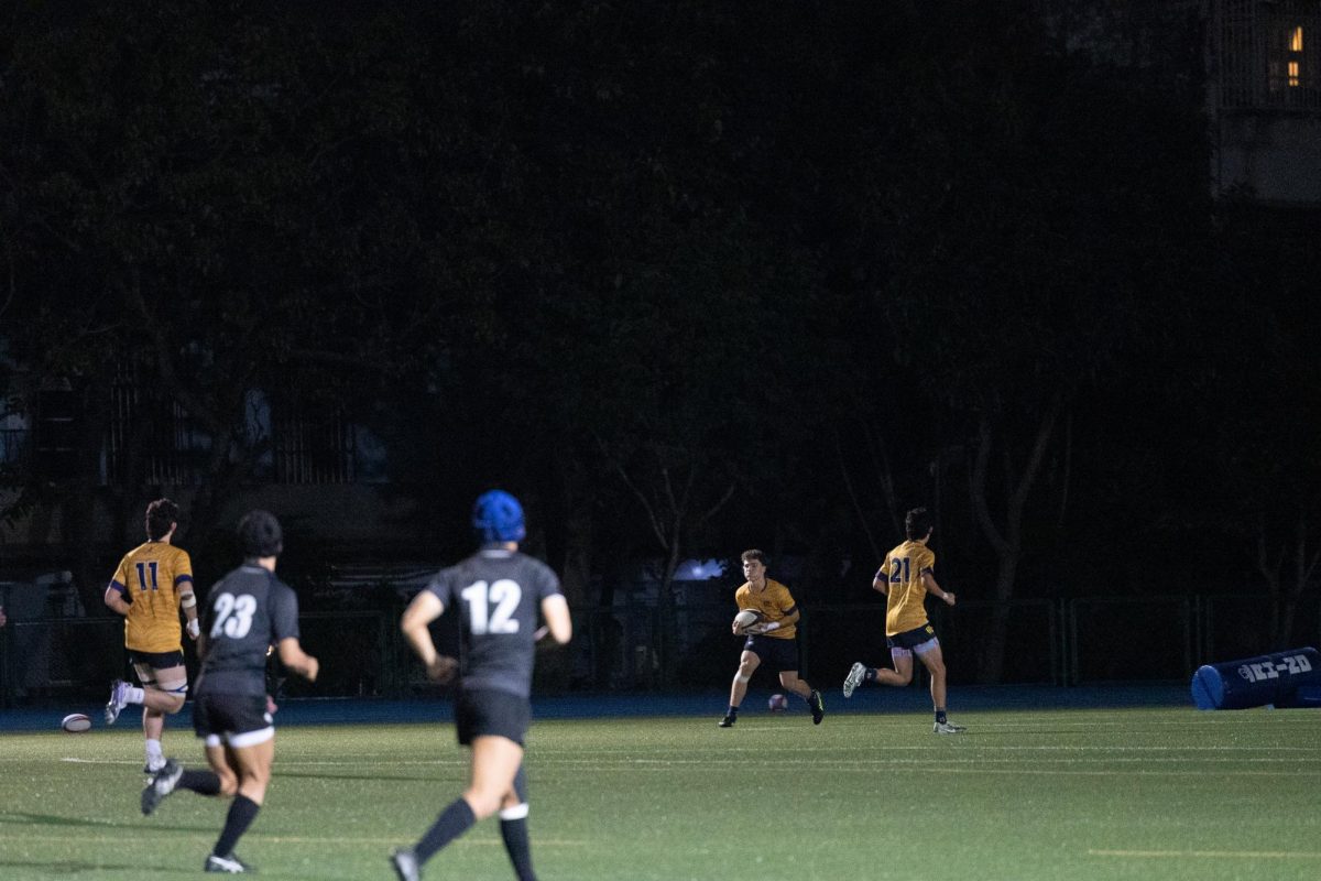 The TAS varsity rugby team plays a game against a local team. [PHOTO COURTESY OF TAS ATHLETICS]