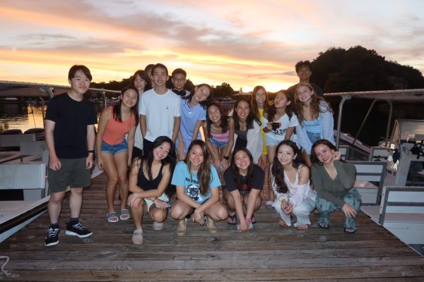 The members of the Palau trip pose in front of a beautiful sunset. [ERIN WU/THE BLUE & GOLD]