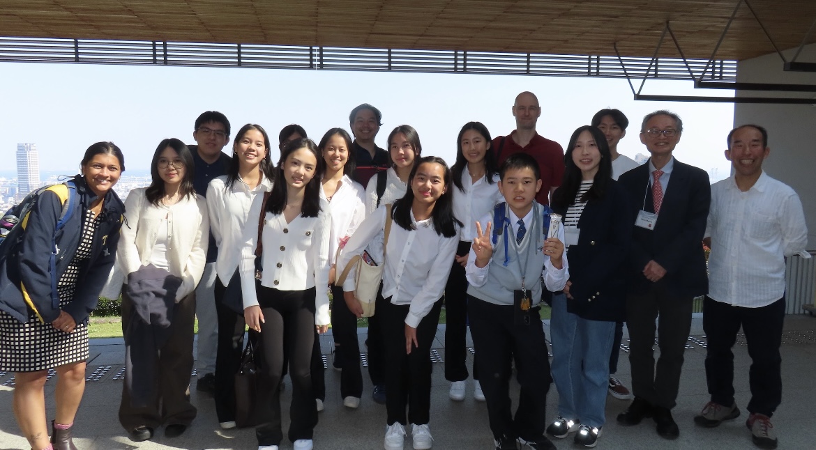The TAS research students and advisors smile with professors and students from Kobe University. [PHOTO COURTESY OF TRISTIN W. (27')