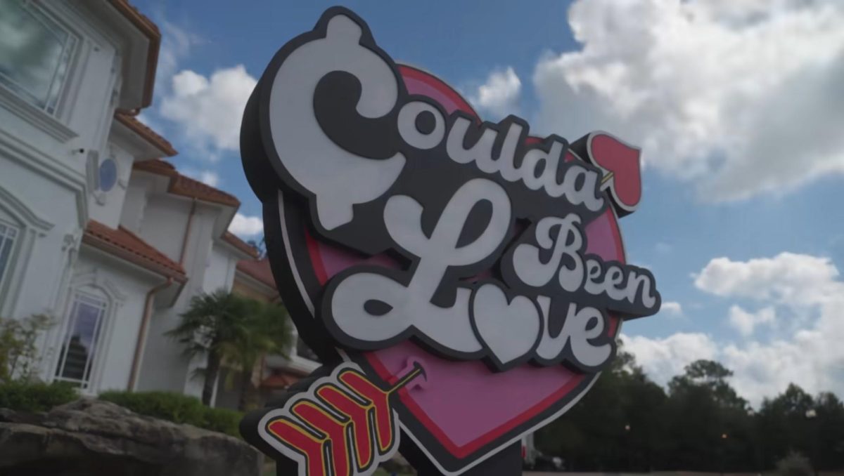 A large "Coulda Been Love" sign in front of the show set. [PHOTO COURTESY OF DRUSKI'S COULDA BEEN LOVE SHOW]