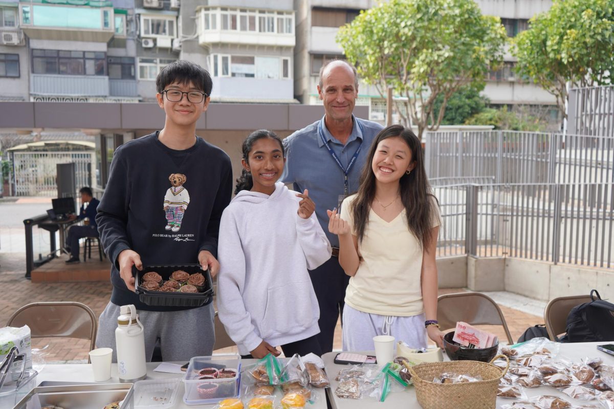 Members of the Sarnellli House Club at their bake sale during IASAS Rugby at TAS. [Annabelle Hsu/The Blue & Gold]
