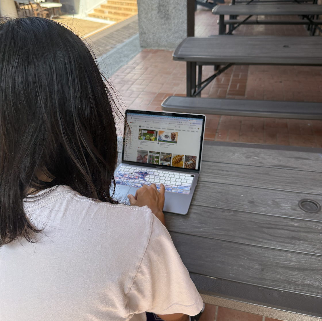 A senior is caught browsing YouTube. [COLIN KUO/THE B&G]