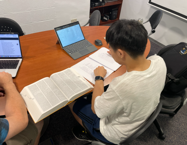 Winston and Dr. Held have class in a library study room. [AARON CHEN/THE B&G]